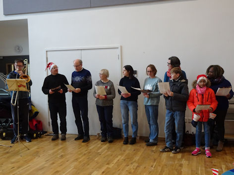Christ Church choir at the Clay Farm Centre Christmas event. Photo: Andrew Roberts, 17 December 2022.