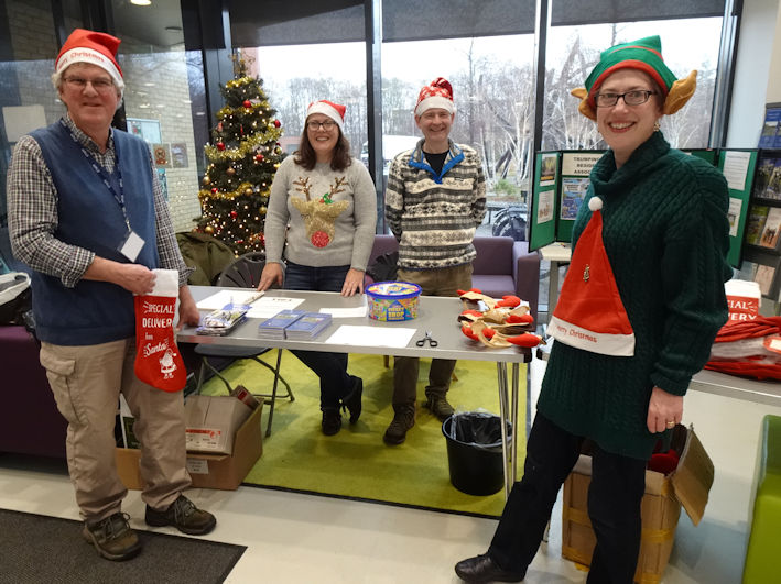 Andrew Roberts, Amanda Nilsson, Andy Blackhurst and Jenny Blackhurst with the TRA table, Clay Farm Centre Christmas Fair. Photo: Andrew Roberts, 9 December 2023.