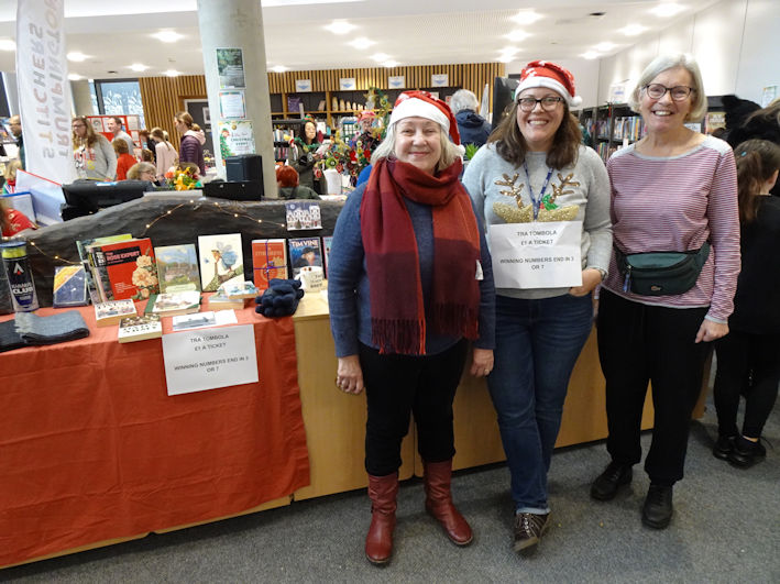 Pam Stacey, Amanda Nilsson and Wendy Roberts, at the TRA tombola stall, Clay Farm Centre Christmas Fair. Photo: Andrew Roberts, 9 December 2023.